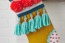 15 a super colorful Christmas stocking with pompoms and tassels is a bright decor idea
