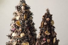 15 pinecone Christmas tree decorated with cinnamon sticks, nuts, citrus and dried fruits for a rustic feel