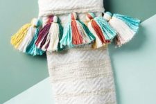 16 your neutral stockings can be spruced up easily with some large and colorful tassels, make and attach them