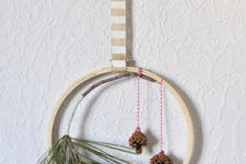DIY all-natural evergreen and pinecone hoop wreath