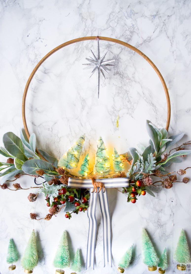 DIY embroidery hoop wreath with fake greenery and little trees (via www.pmqfortwo.com)