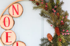 DIY rustic Christmas wreath with wood slices and faux greenery