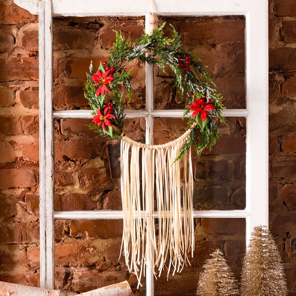 DIY embroidery hoop and fake greenery and fringe wreath (via www.brit.co)