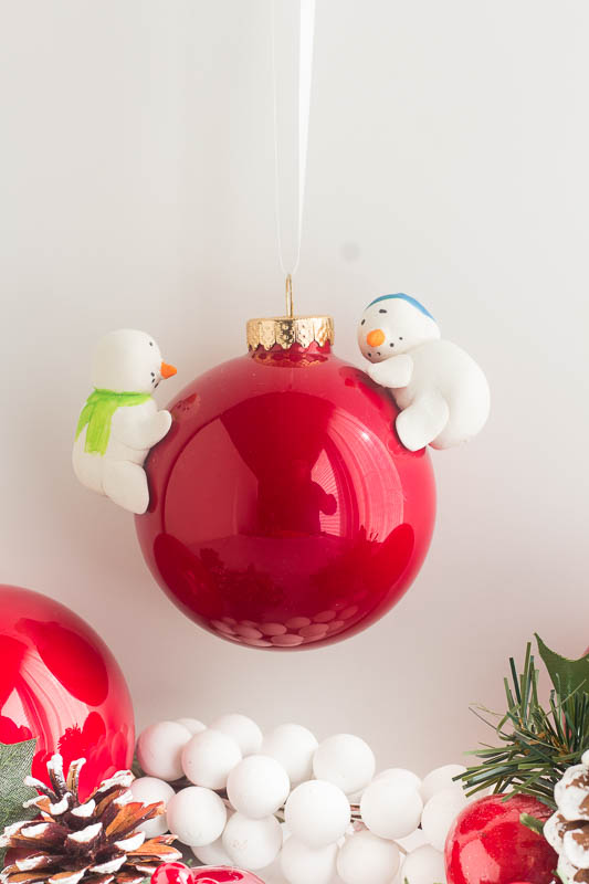 DIY red Christmas ornament with snowmen attached