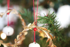 DIY gold greenery wreath ornament with a jingle bell