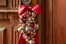DIY jingle bell cluster ornament with a large red bow