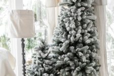 02 a duo of non-decorated flocked Christmas trees is a great idea for a modern or farmhouse space