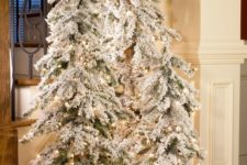 05 create a winter wonderland with a trio of flocked Christmas trees with lights and some white fabric at the base