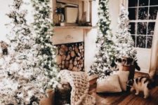 06 a whole group of lit up Christmas trees – two on each side is a great modern decor idea