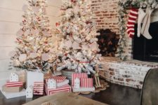 11 a duo of flocked Christmas trees with lights, star toppers, paper buntings makes a holiday statement