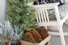 11 a vintage crate filled with large pinecones is a great outdoor decor idea