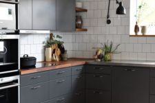19 a contemporary graphite grey kitchen with white tiles and rich-colored wooden countertops to refresh