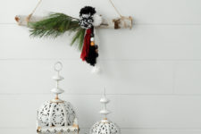 DIY modern boho Christmas wreath with pompoms and tassels with evergreens