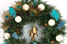 DIY boho lux Christmas wreath with peacock feathers and bells