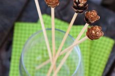 DIY gilded pinecone drink stirrers for holidays