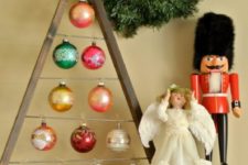 DIY A-framed Christmas tree ornament display with colorful ornaments
