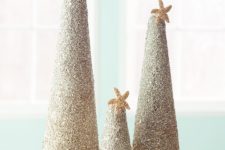 DIY coastal glitter Christmas trees with star fish toppers