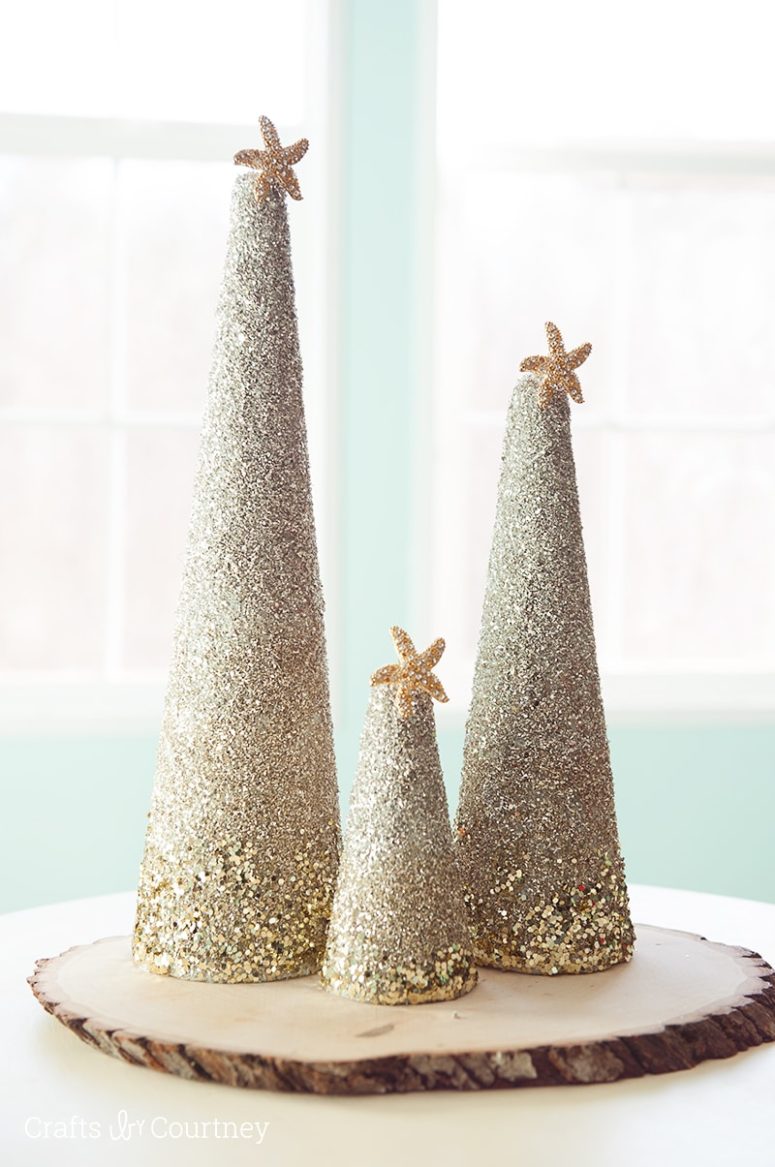 DIY coastal glitter Christmas trees with star fish toppers (via www.craftsbycourtney.com)