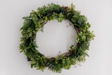 DIY faux evergreen Christmas wreath with a vine base