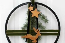 DIY modern and elegant Christmas wreath with green velvet ribbon and wooden stars