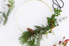 DIY cheerful modern Christmas wreath with fake berries and leaves