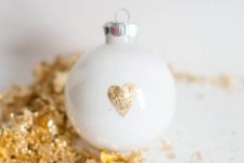 DIY white Christmas ornaments with gold leaf hearts