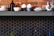 03 a brick wall with a navy hex tile backsplash and white grout is a bold idea for a contemporary kitchen