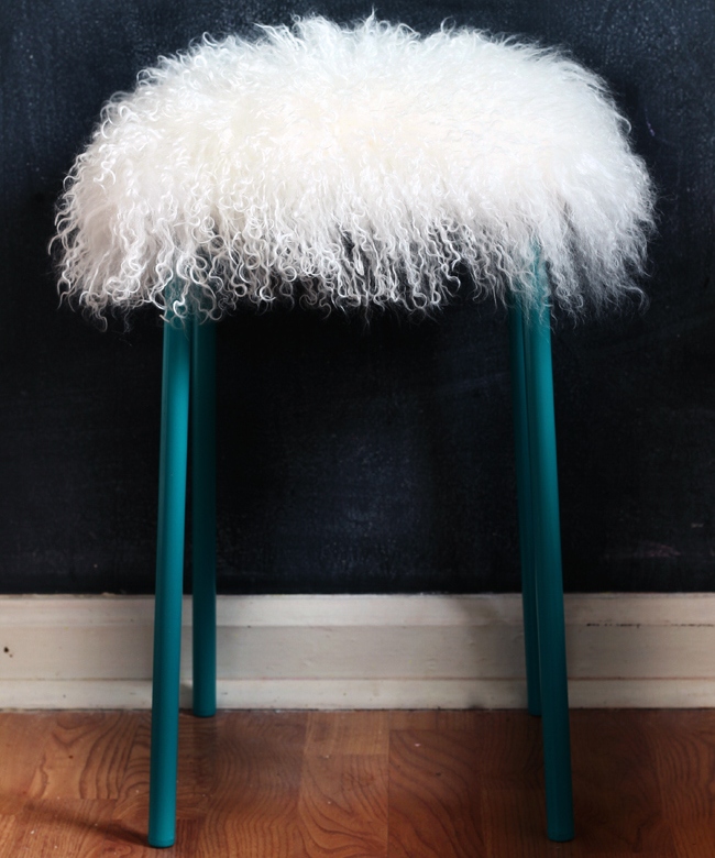 IKEA Marius stool painted teal and topped with some faux lambwool is a great piece for your home