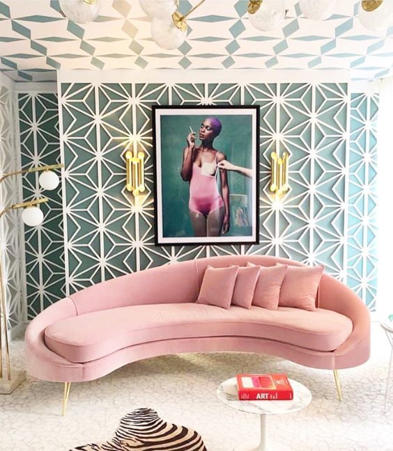 a pink curved couch is a perfect base for a girlish living room or bedroom