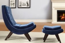 11 a comfy navy velvet curved chair with a matching curved footrest for a cozy nook