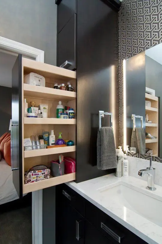 a comfy storage unit hidden in the large cabinet by the sink is a very functional idea to rock