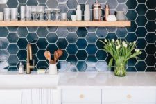 12 chic dark green hexagon tiles with white grout make a bold statement in a neutral space