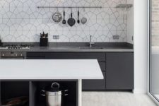 a kitchen backsplash with a geometric hex tiles