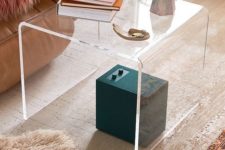 16 such a curved acrylic side table will add a modern and edgy feel to the space easily