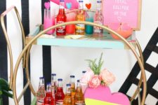 a modern glam bar cart with neon touches – pink, yellow and green, hearts and a pink sign