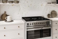 a modern neutral kitchen with a gorgeous hexagon tile backsplash imitating marble, white stone countertops