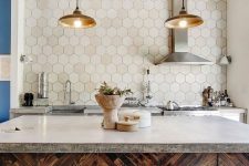 a quirky kitchen with rich-stained cabinets, concrete countertops and an extended hexagon tile backsplash plus pendant lamps