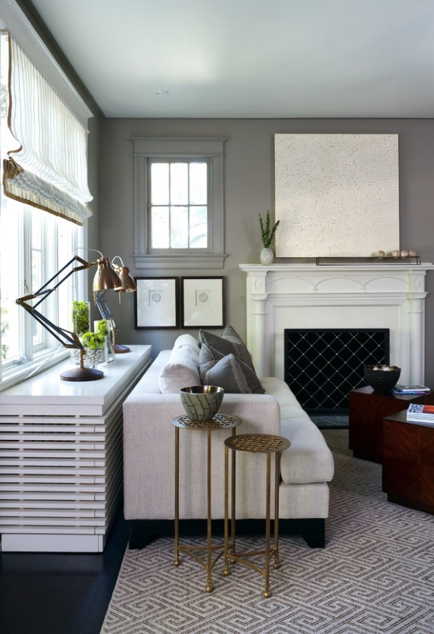 a radiator covered with a countertop and planked screen doubles as a console table and display table, it's chic