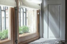 a radiator turned into a daybed with a cover with a screen and a large cushion is a smart idea to avoid an eye-sore