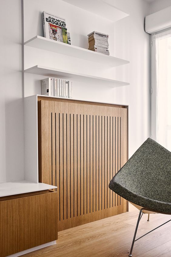a stylish radiator cover of light stained timber will let you seamlessly integrate your radiator into the space