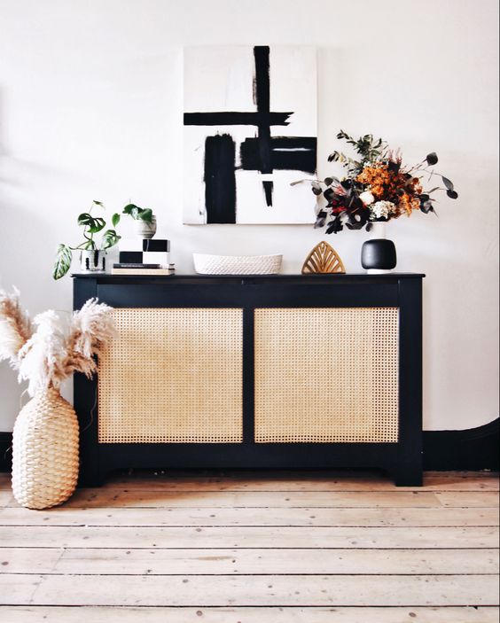 a stylish radiator cover with black framing and cane screens is perfect for a modern entryway or living room