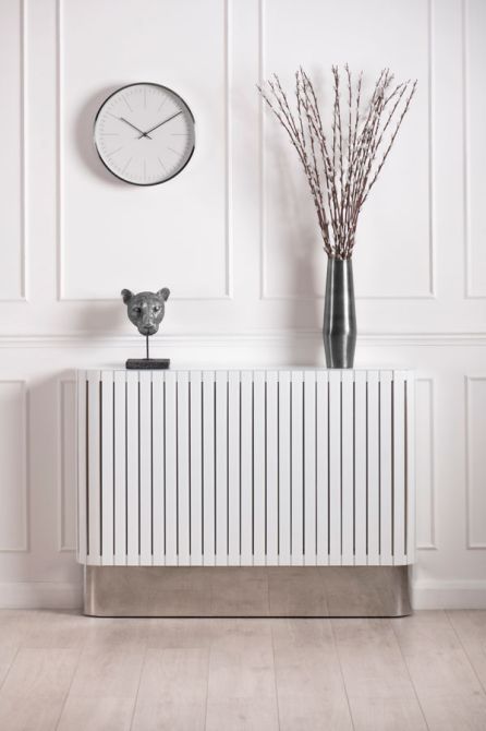 a stylish white planked radiator cover as an elegant console table for an entryway or a living room