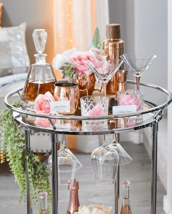 a very romantic Valentine bar cart styled with only pink blooms and some greenery looks elegant