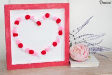 DIY colorful pompom heart sign for Valentine’s Day