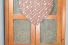 DIY salvaged wood heart-shaped sign with arrows