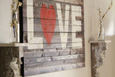 DIY rustic pallet LOVE sign with a red heart