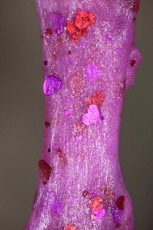DIY hot pink glitter slime with hearts (via thenerdswife.com)