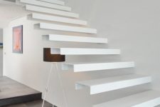 02 a white floating staircase of metal attached to the wall is a gorgeous modern idea