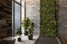 03 a lush greenery wall and some potted plants are a cool idea for a contemporary and bold space