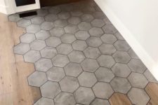 07 hexagon concrete tiles in the most walkable zone and wooden laminate in the rest of the space